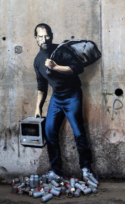 Street artist Banksy takes on migrant crisis with image of migrant Steve Jobs in Calais camp | iNFOnews.ca Street artist Banksy takes on migrant crisis with image of migrant Steve Jobs in Calais camp | iNFOnews.ca