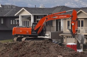 A backhoe digging a basement.