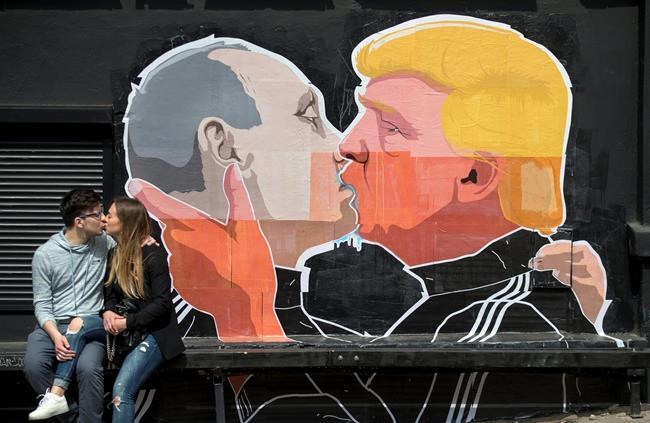 Poster at Lithuanian eatery: Trump locking lips with Putin | iNFOnews.ca Poster at Lithuanian eatery: Trump locking lips with Putin | iNFOnews.ca