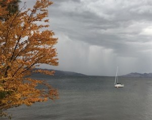 A sailboat on Okanagan Lake in Kelowna on a blustery fall day.