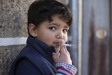 PHOTOS: Kids encouraged to smoke in Portugal at Epiphany | iNFOnews.ca