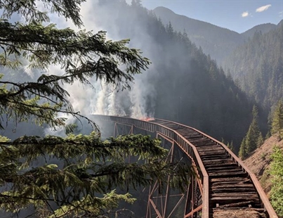 Small wildfire burns under century-old rail trestle in B.C. | iNFOnews.ca
