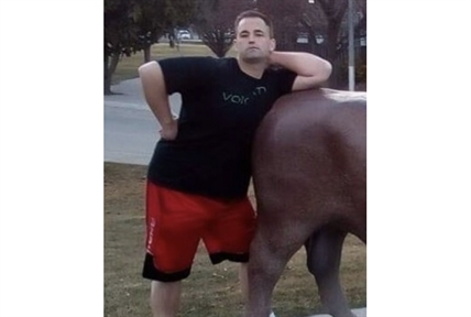 Kamloops man accused of killing robbery accomplice in 2021 | iNFOnews.ca A photo of a man leaning on a public art piece.