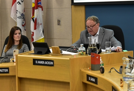 Lawyers for Kamloops mayor, councillor face off for week-long hearing | iNFOnews.ca A man and a woman seen at a city council meeting.