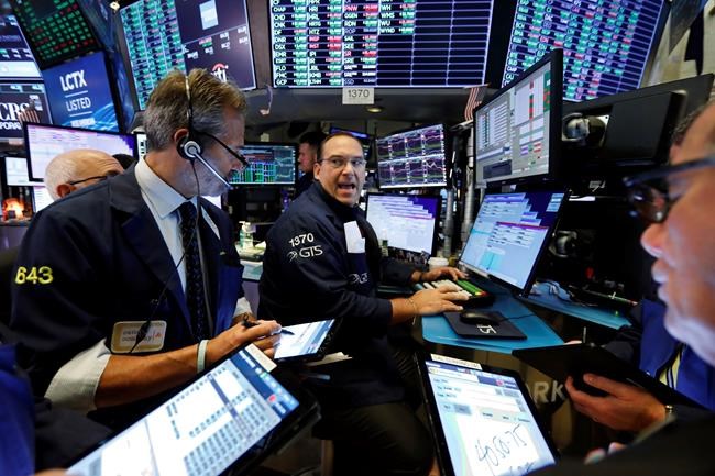 Wall Street posts solid gains after surge in corporate deals | iNFOnews.ca CP650539152