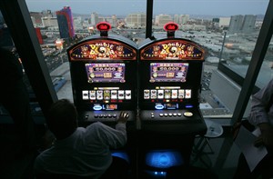 Scientific Games strikes $3.3-billion cash deal to buy slot machine maker Bally Technologies | iNFOnews.ca CP29343796