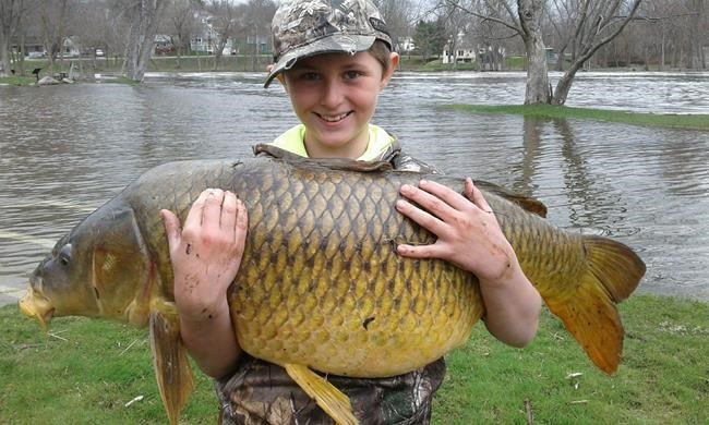Photo: Vermont boy reels in a record-setting carp | iNFOnews.ca