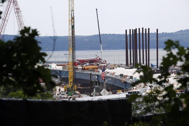 Crane on new bridge topples over onto lanes of old bridge | iNFOnews.ca