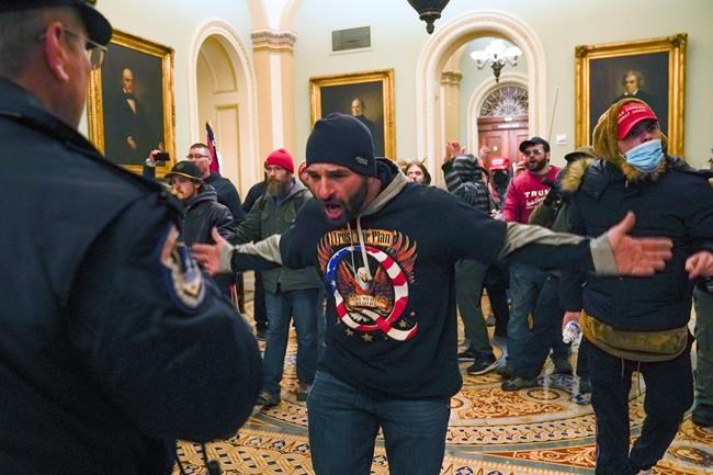 FBI: QAnon backer from Iowa was among 1st to breach Capitol | iNFOnews.ca FBI: QAnon backer from Iowa was among 1st to breach Capitol | iNFOnews.ca