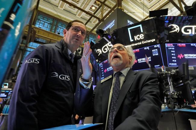 World stocks mixed after Wall Street sinks despite rate cut | iNFOnews.ca CP615676135
