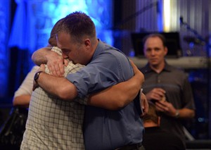 'A time for healing,' pastor tells church service days after Mountie shootings | iNFOnews.ca CP28677202