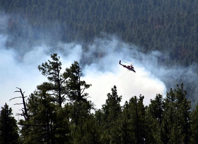 The Latest: Officials: Illegal campfire sparked Arizona fire | iNFOnews.ca