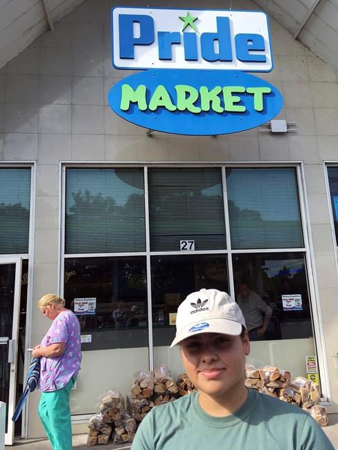 The Latest: Clerk just happy to have touched winning ticket | iNFOnews.ca