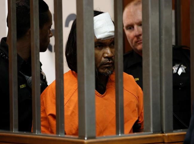 The Latest: Suspect in police killing wears bandage to court | iNFOnews.ca