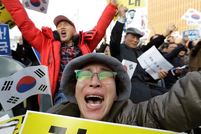 S. Korean lawmakers pass law on independent probe of Park | iNFOnews.ca