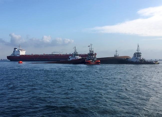 Tanker, dredger collide off Singapore; 2 dead, 3 missing | iNFOnews.ca