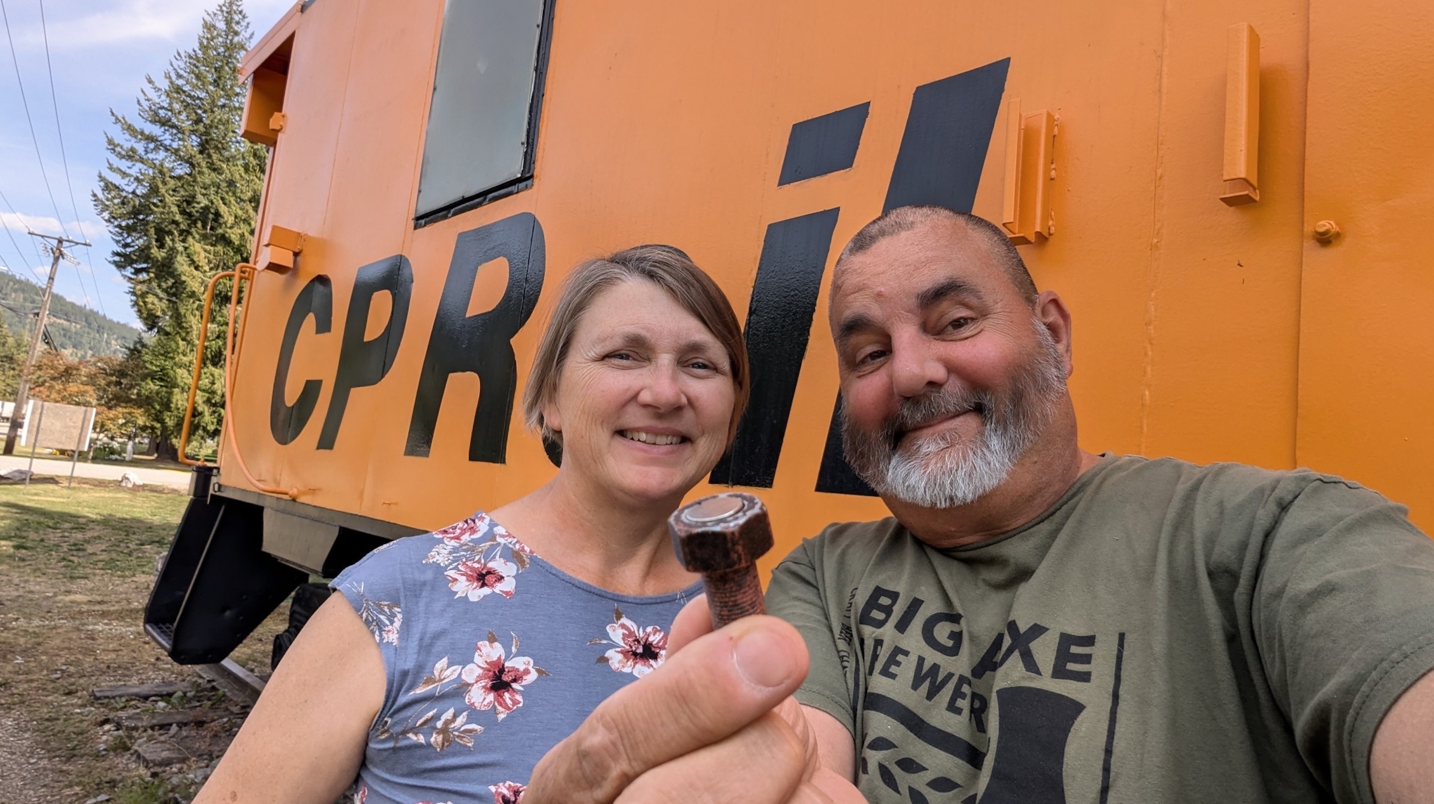 Dave and Karen Westhouse and with a geocache find.