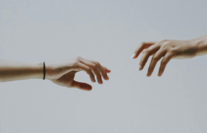 Photo illustration of hands reaching for each other