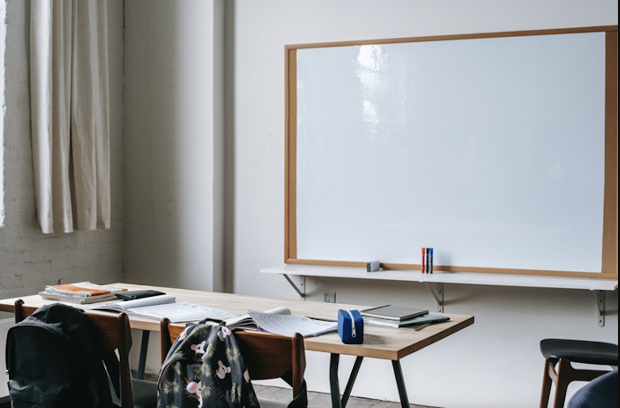 BC teacher who 'made contact' with student gets reprimanded | iNFOnews.ca A teacher's desk and white board.