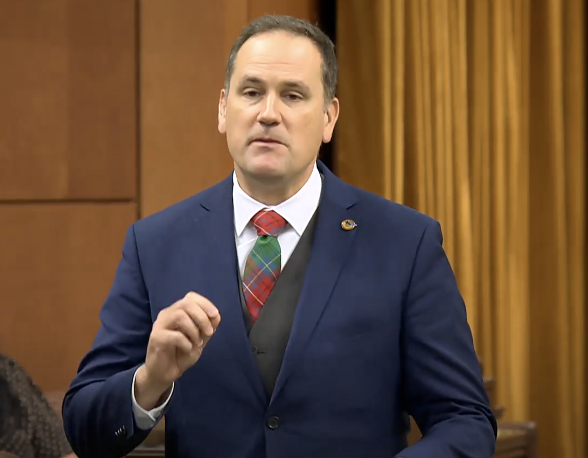 Dan Albas in actually a pretty nice blue suit.