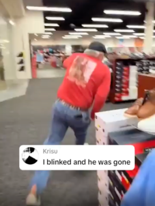 A man running in a shoe store.