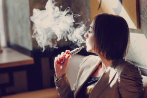 A woman vaping.