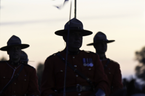 The silhouette of three RCMP officers.
