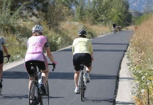 Cyclists on a paved bike path.