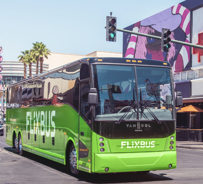 A Flixbus coach drives along the road.