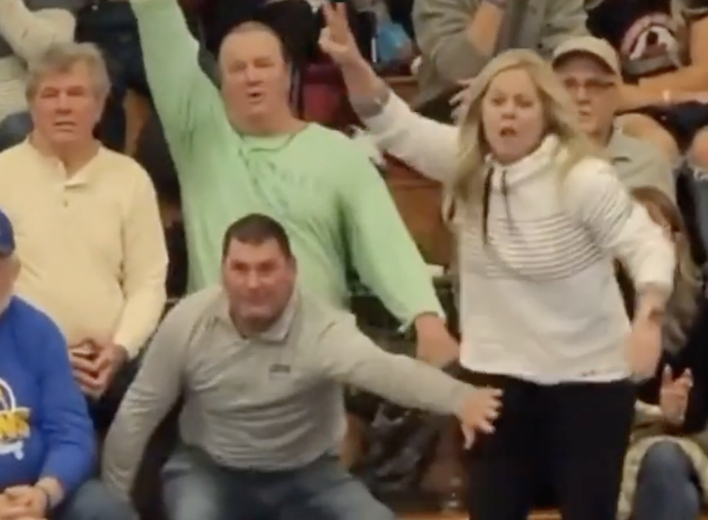 TRENDING NOW: Mom should be the one wrestling in this tournament | iNFOnews.ca A man stopping a woman from running out into a wrestling tournament.