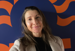 A woman takes a selfie of herself.