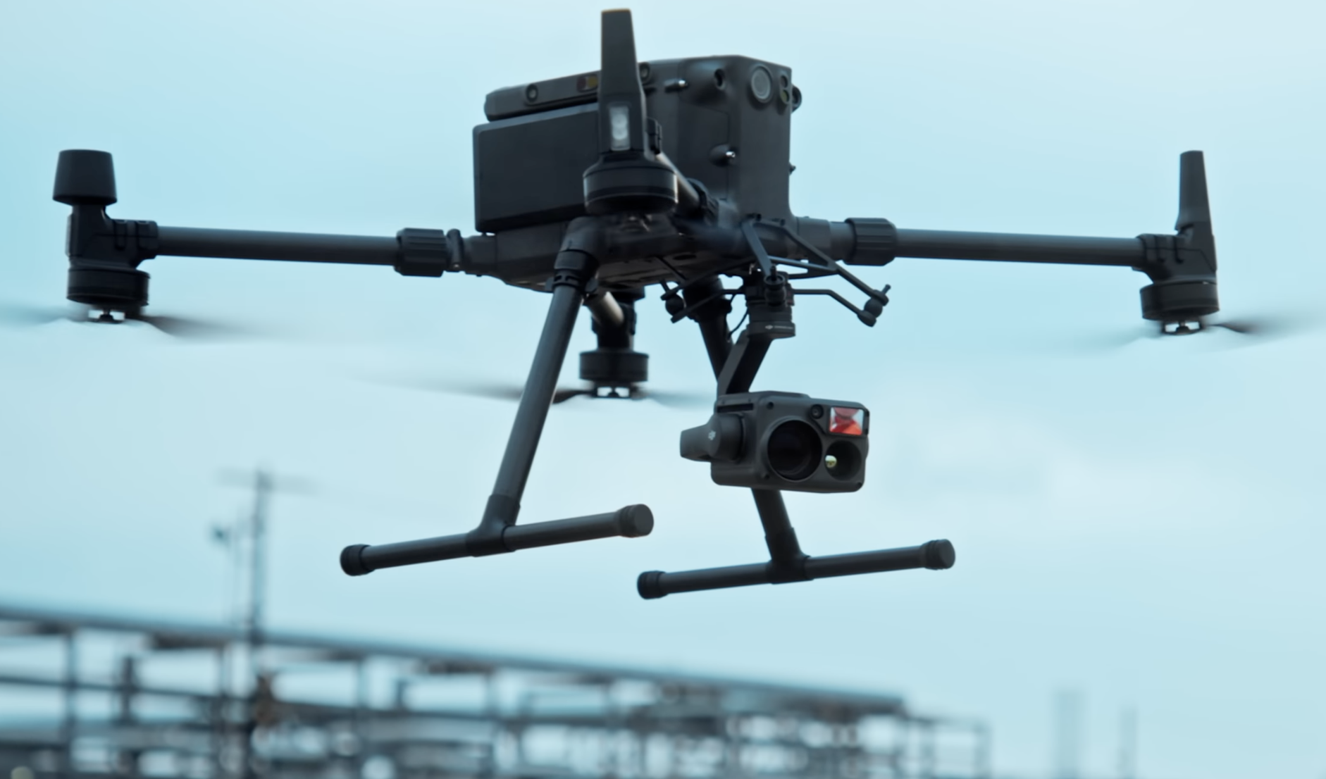 A drone in flight with a camera.