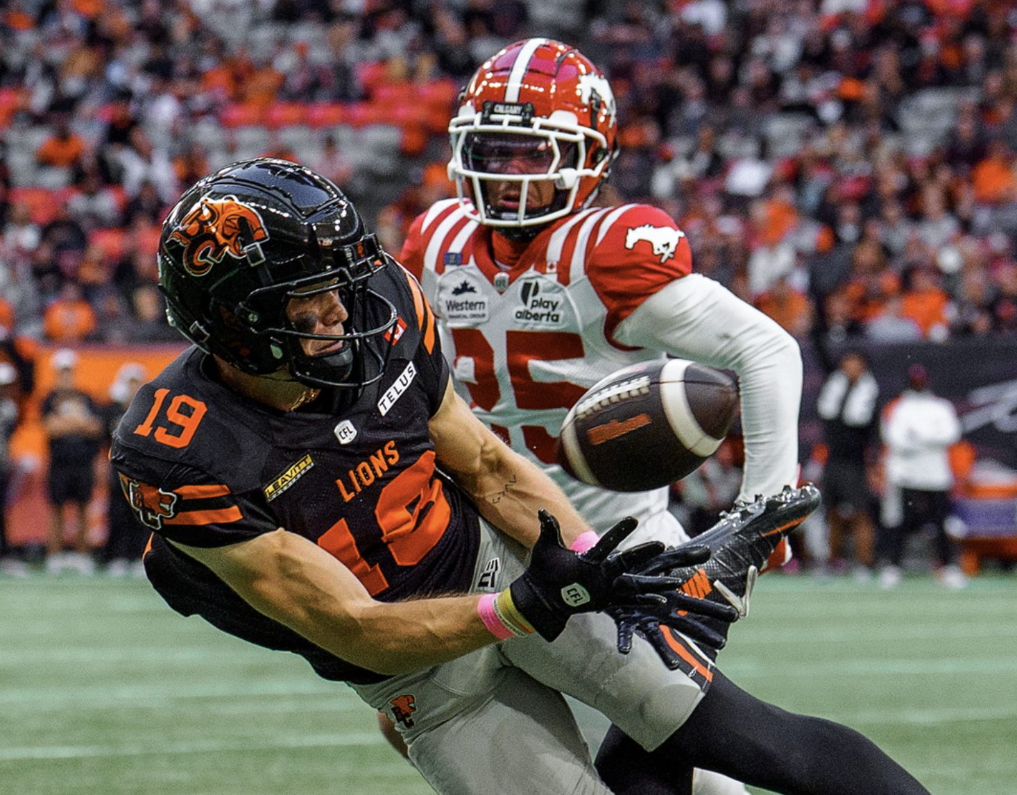 A football player making a catch.