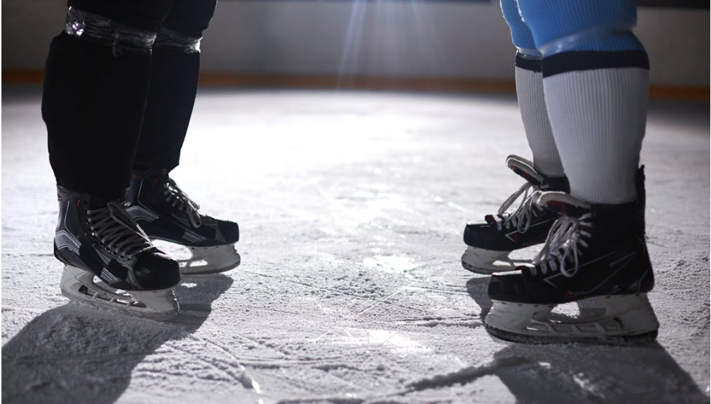 Kamloops arena project may reach $154M | iNFOnews.ca Two hockey players face each other on the ice.
