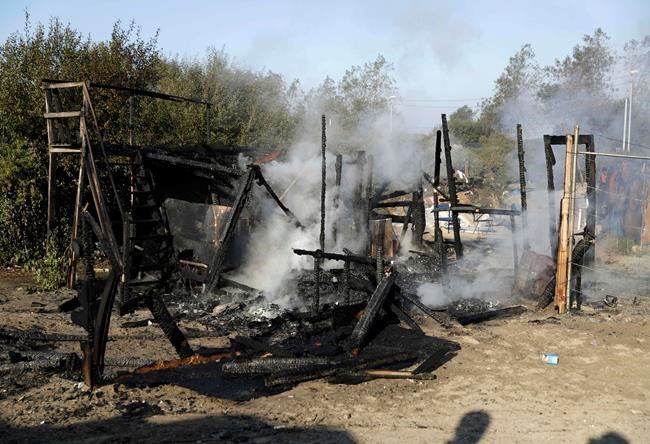 Evacuation in progress, crews tear down French migrant camp | iNFOnews.ca