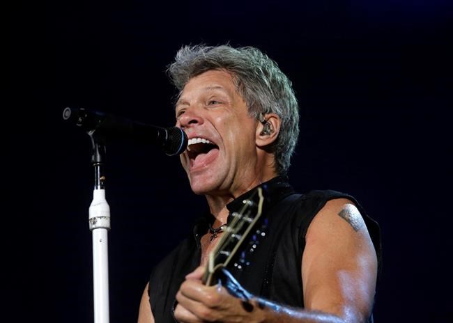 Jon Bon Jovi surprises cancer-stricken fan with guitar, kiss | iNFOnews.ca CP1120259660