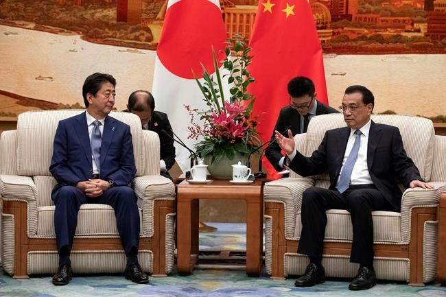 Japan's Abe in China as 2 nations try to mend ties | iNFOnews.ca CP203393678