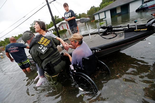 Harvey reporters cast aside role as observers to help | iNFOnews.ca