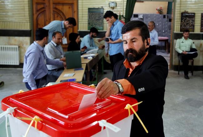 Iran votes in parliamentary runoff as rare shooting wounds 4 | iNFOnews.ca