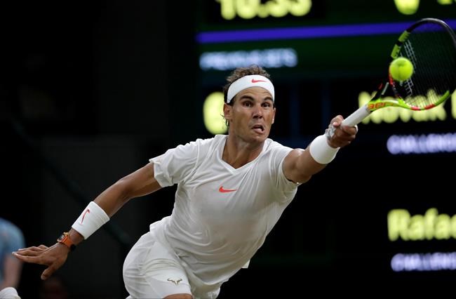 Anderson tops Isner 26-24 at Wimbledon; other SF suspended | iNFOnews.ca CP1958527775