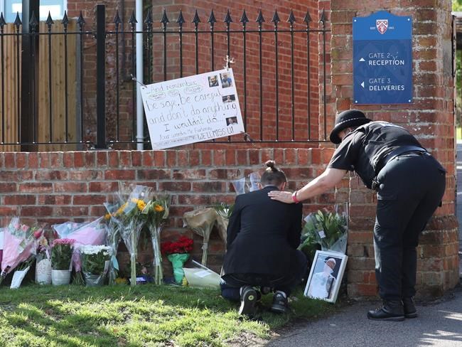 English town mourns victims of suspected terror attack | iNFOnews.ca CP1123282265