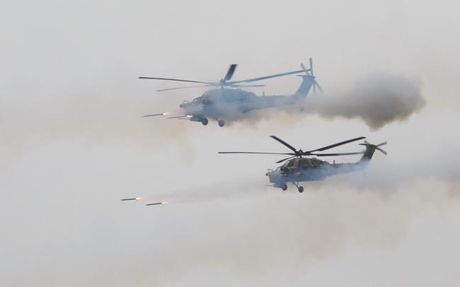 Report: Russian helicopter fires on spectators at drills | iNFOnews.ca