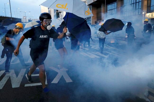 The Latest: Hong Kong police battle protesters with tear gas | iNFOnews.ca CP1954518164