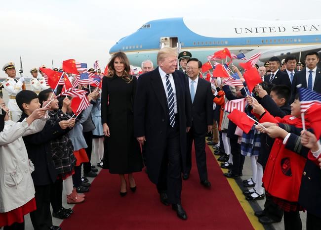 Soldiers, jumping children greet Trump at Beijing airport | iNFOnews.ca