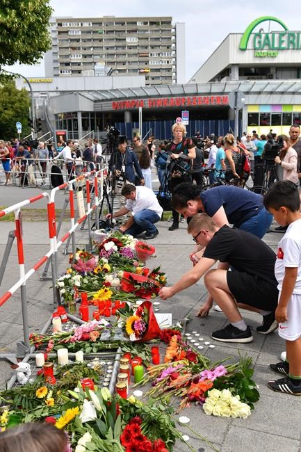 After Munich shooting, tearful witnesses linger at scene | iNFOnews.ca After Munich shooting, tearful witnesses linger at scene | iNFOnews.ca