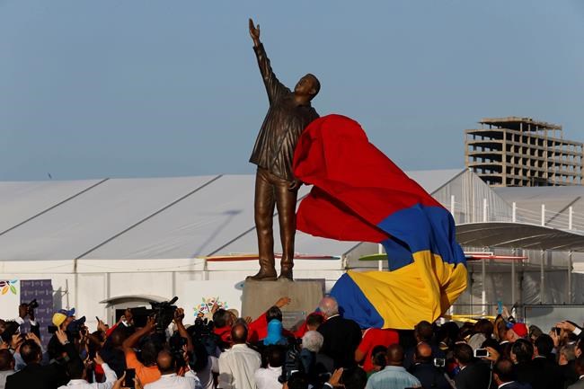 Angry Venezuela protesters take aim at Chavez statues, home | iNFOnews.ca