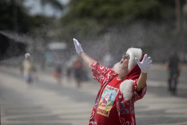Santa, with surfboard, celebrates Brazil's 1st day of summer | iNFOnews.ca