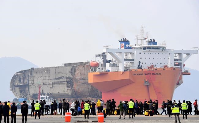 Raised South Korean ferry Sewol arrives at port for search | iNFOnews.ca Raised South Korean ferry Sewol arrives at port for search | iNFOnews.ca