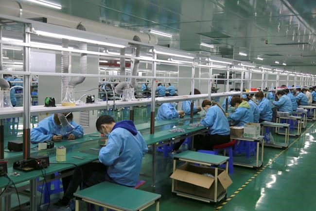 Chinese manufacturing rises in April but growth might slow | iNFOnews.ca CP1992791545