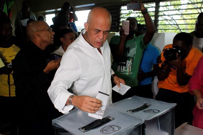 After lengthy drift, Haiti votes for new leader | iNFOnews.ca CP1148537364